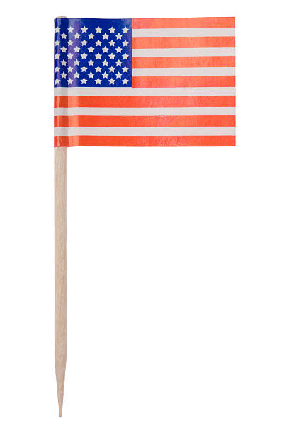 American flag toothpick (XL) One of those tiny flags on a toothpick. This one is the American flag. Isolated on a pure white background.   toothpick stock pictures, royalty-free photos & images