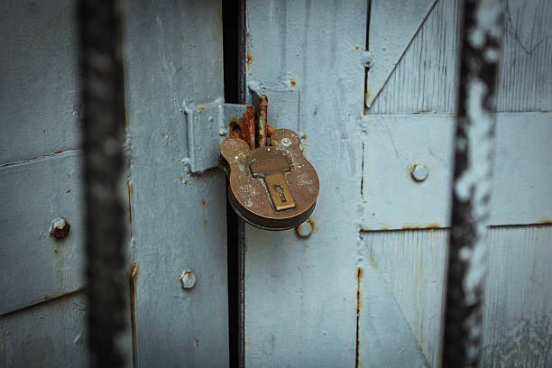 Vintage lock against wooden door stock photo