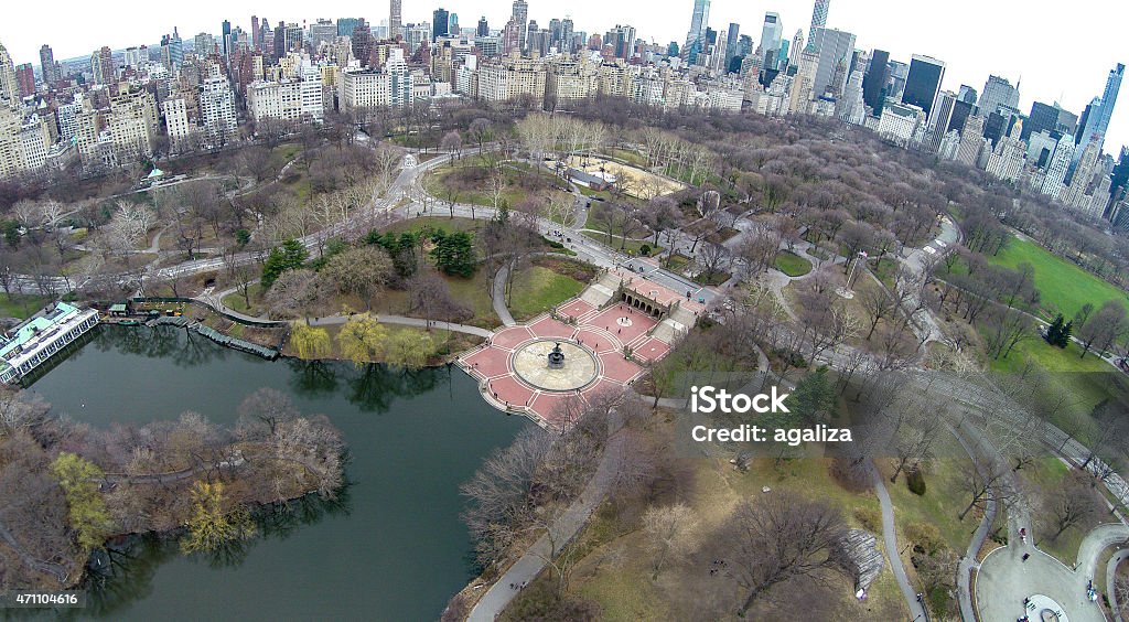 Aerial view of Lower Central Park and Bethesda Fountain Aerial view of Central Park with Bethesda Fountain, Literary Walk, Sheep's Meadow  in frame, and also midtown Manhattan's skyscrapers and east side residential buildings Bethesda - Maryland Stock Photo