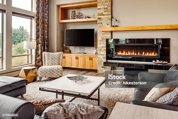 Living Room In Luxury Home With Fireplace And Tv Stock Photo - Download Image Now - Domestic Room, Fireplace, Living Room