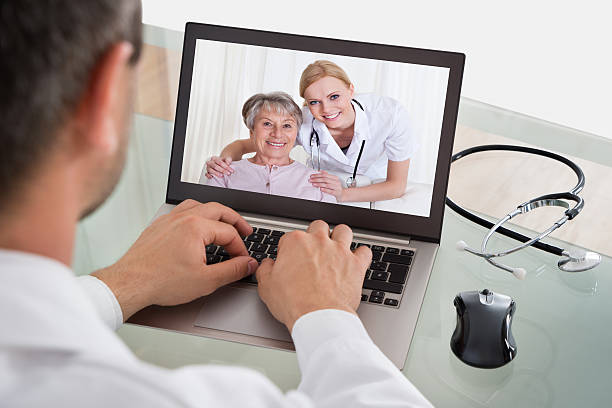 istock Doctor Video Chatting With Nurse And Patient 471104764