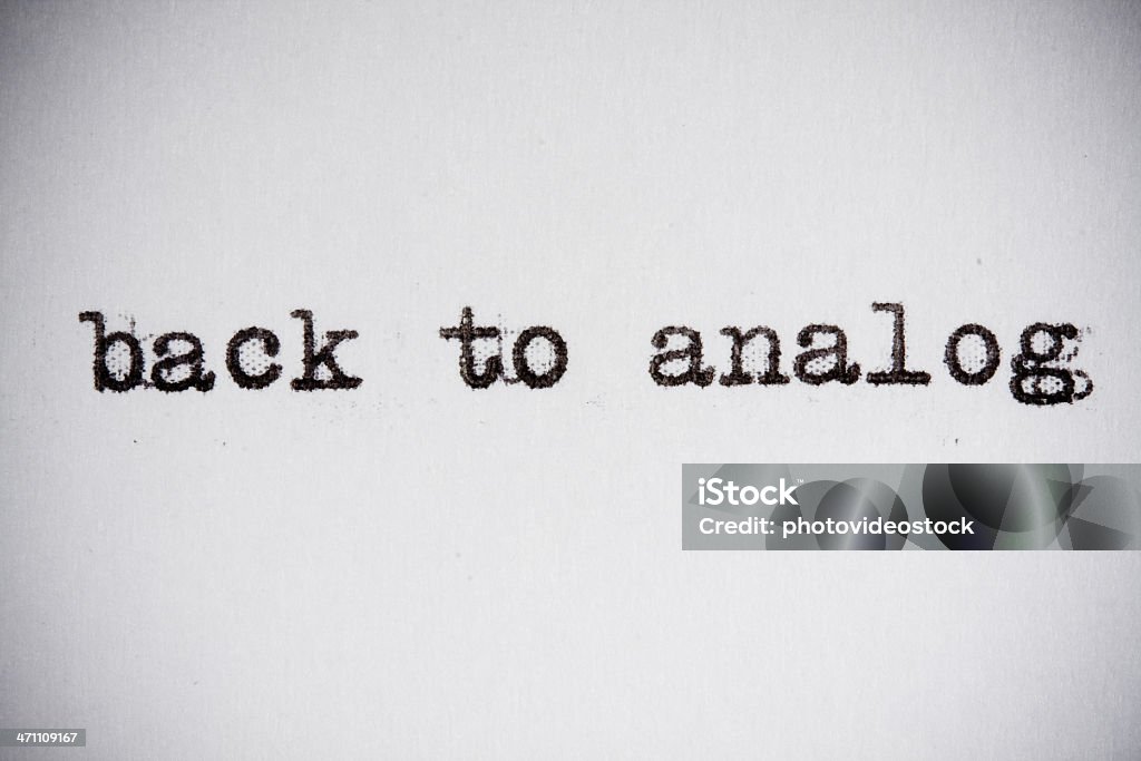 back to analog "back to analog" typewritten sentence. Abstract Stock Photo