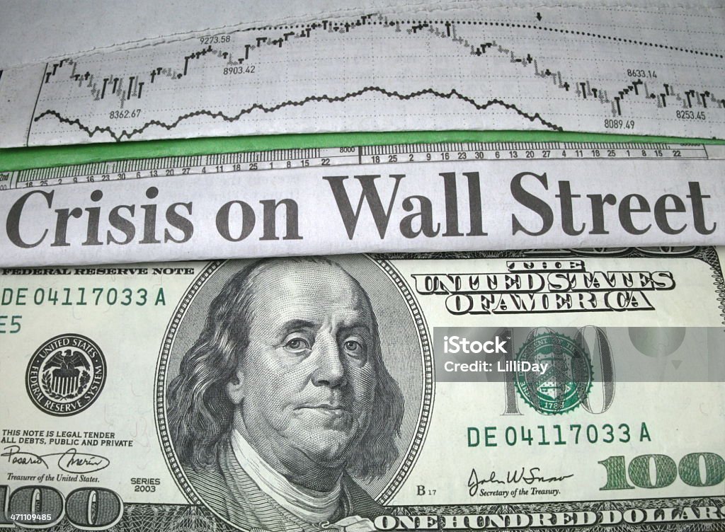 Crisis on Wall Street and Cash Newspaper headline "Crisis on Wall Street" and currency Banking Stock Photo