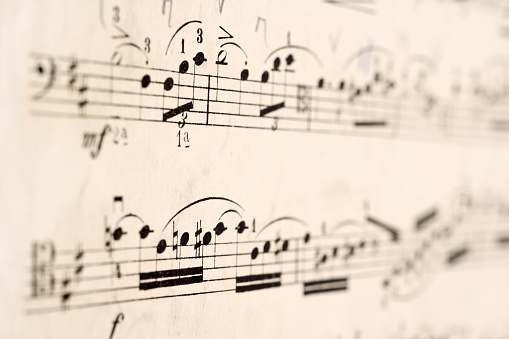 Close up of 100 year old sheet music, shallow depth of field.