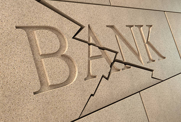 Collapsing bank sign High quality 3d rendering of a sandstone 'BANK' sign breaking up with cracks collapsing stock pictures, royalty-free photos & images