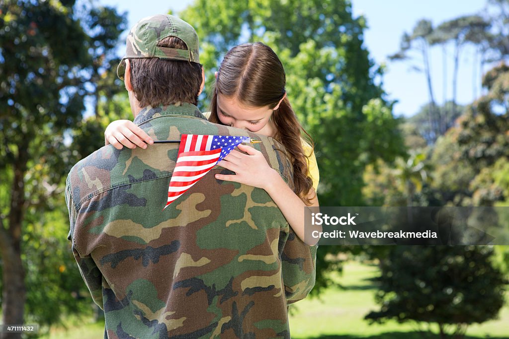 American soldier reunited with daughter American soldier reunited with daughter on a sunny day 2015 Stock Photo