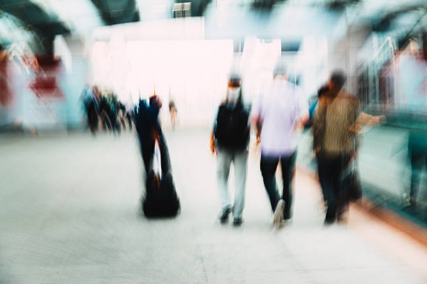 istock Pedestrians walking with zooming motion blur 471111696