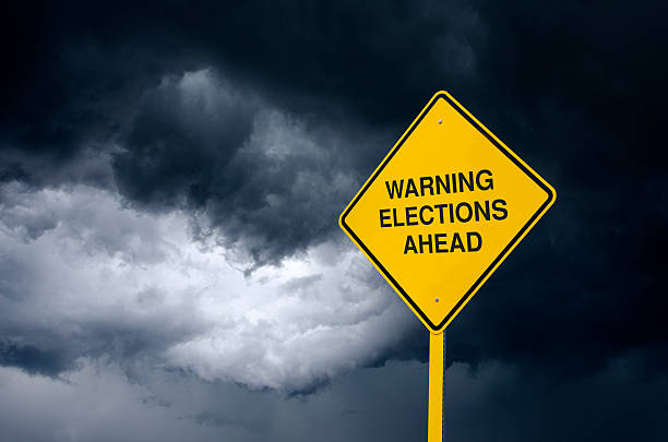 istock Elections Ahead Road Sign in Front of Storm Clouds 471112112