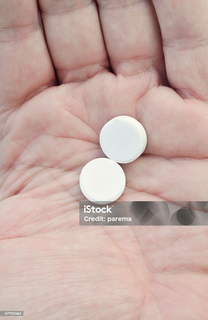Pillole e il palmo della mano - Foto stock royalty-free di Antibiotico