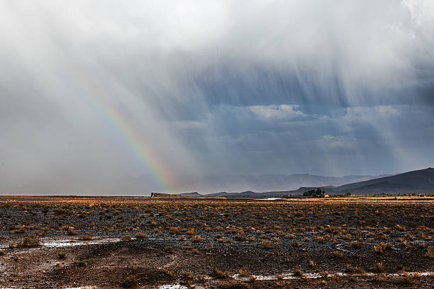 This is a very bright rainbow that showed up after a hard thunderstorm in the desert outside of Moab, Utah.  This was one of the brightest rainbows I have ever seen and a second rainbow formed over the top of the first.