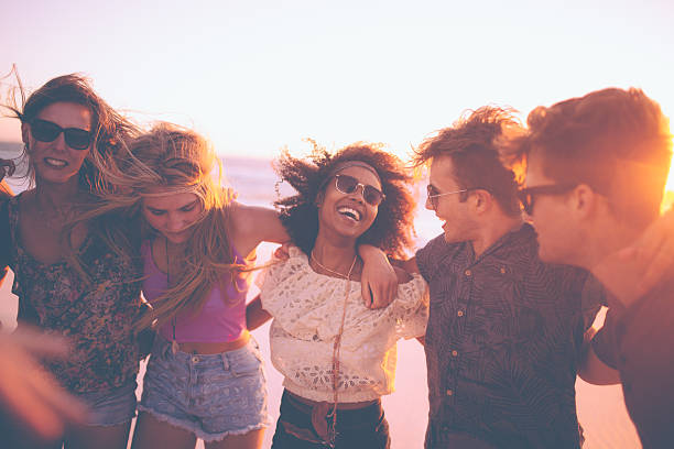 istock Friends standing in a row at a summer evening beachparty 471113310