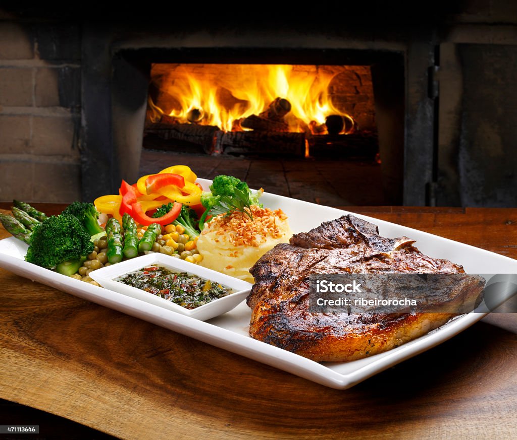 t-bone t bone steak with potato salad and vegetables Aberdeen Angus Cattle Stock Photo