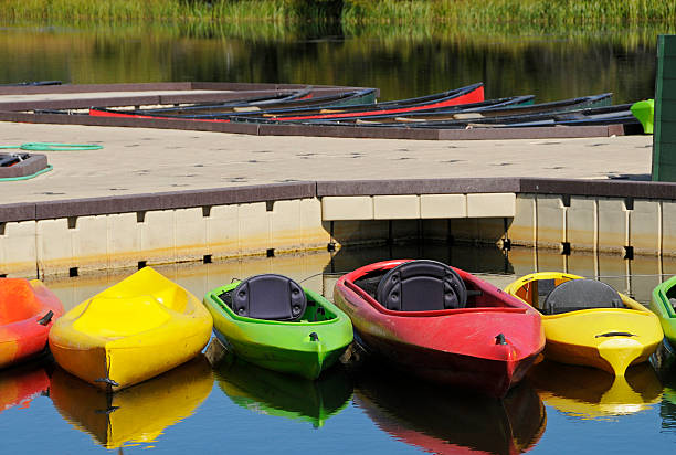 istock Fiberglass kayaks at marina 471114285