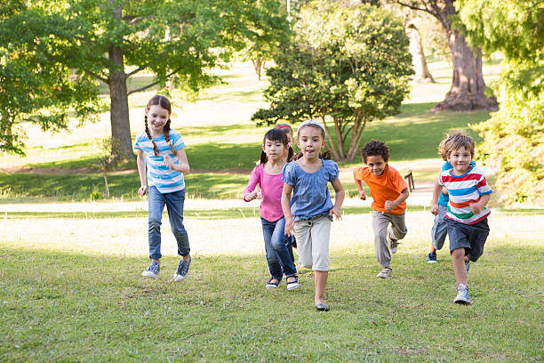 istock Children racing in the park 471114370