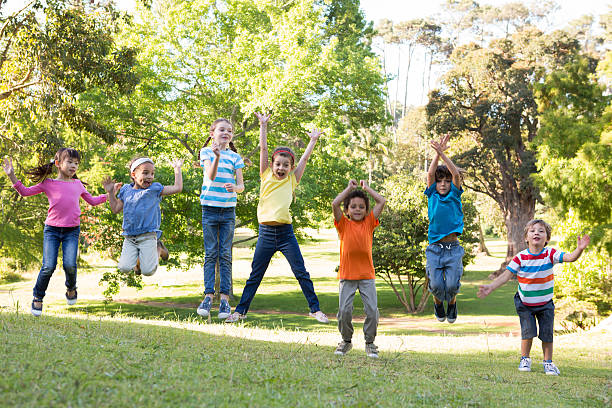 istock Children jumping in the park 471114394