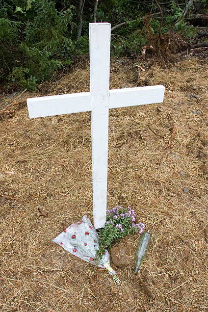 istock Cross at vehicle accident site 471114897