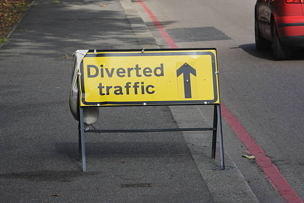 istock Yellow notice diverted traffic go straight ahead 471115443
