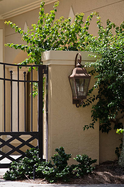 istock Lantern on Gate to Estate Home 471115485