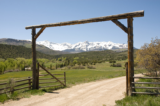 Gate framing the Rocky Mountains in Colorado, USA.