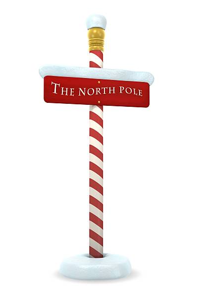 A red and white sign of the North Pole colorful sign post with the words "the north pole"featured. north pole photos stock pictures, royalty-free photos & images