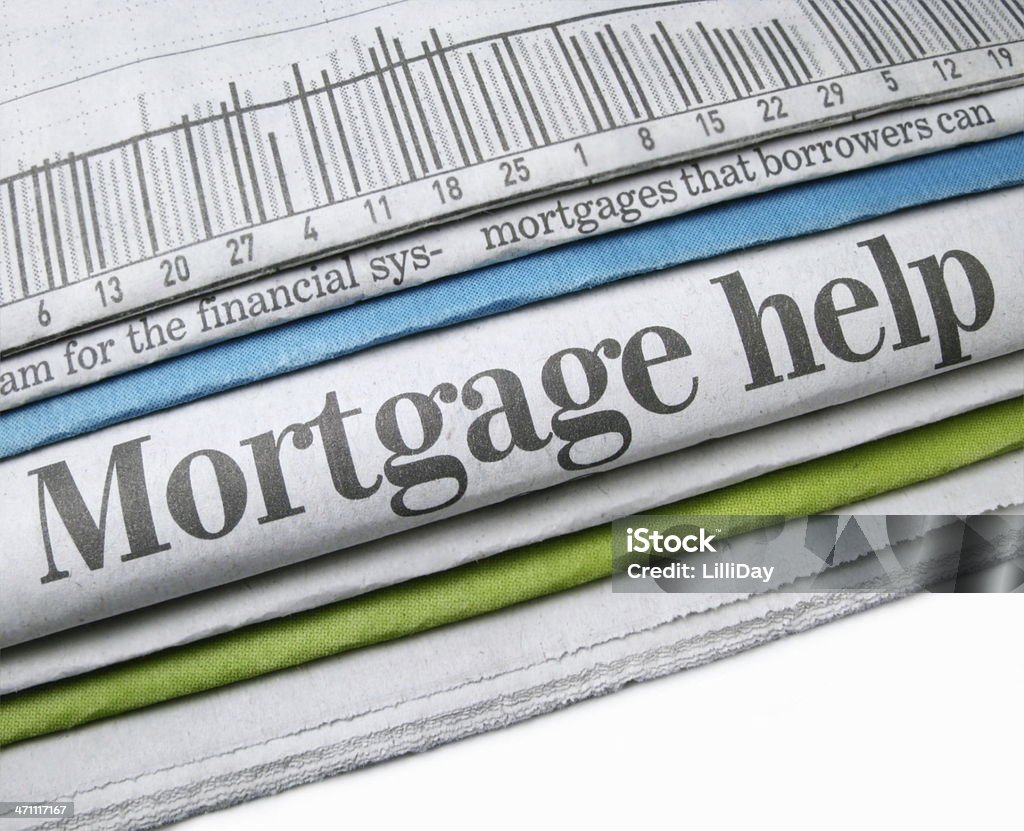 Mortgage Help Close-up of newspaper stack with "Mortgage help" headline Foreclosure Stock Photo