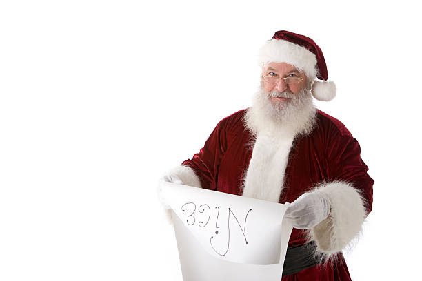 istock Real Santa Claus on White Reading Nice List Copy space 471117209