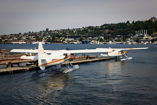 Seaplanes landing and parking at the Pier of Lake Union in Summer. Seattle, USA.