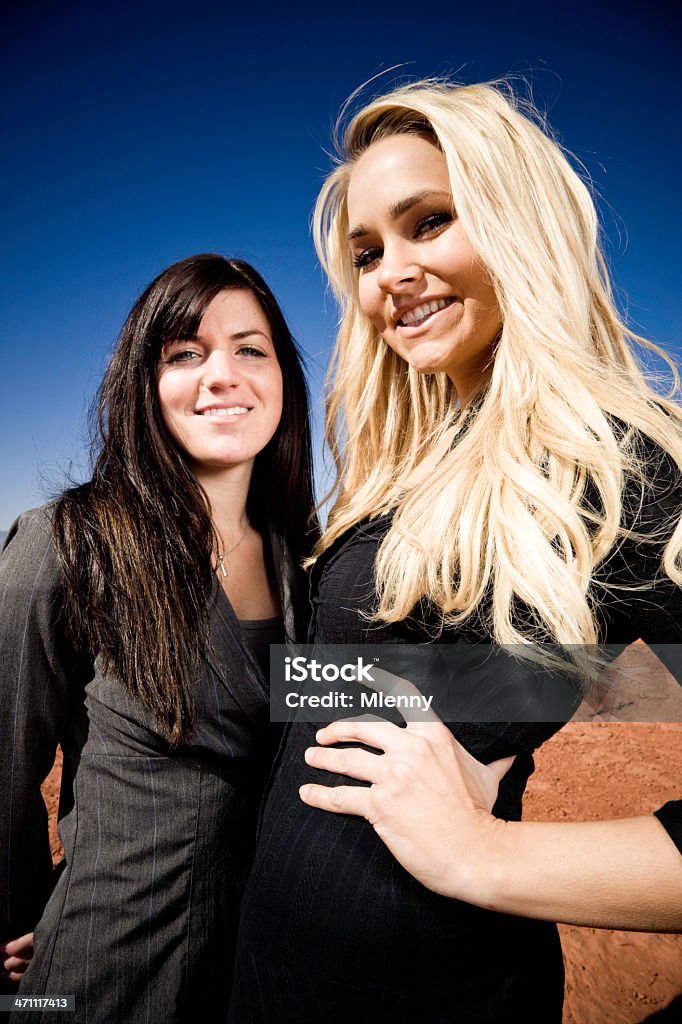 Business Women young businesswomen, standing confident side by side, smiling. 20-24 Years Stock Photo