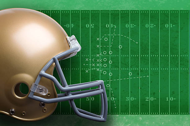 istock Football helmet on field 471117581