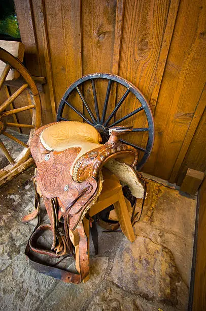 Western Saddle on a chair with copy-space.