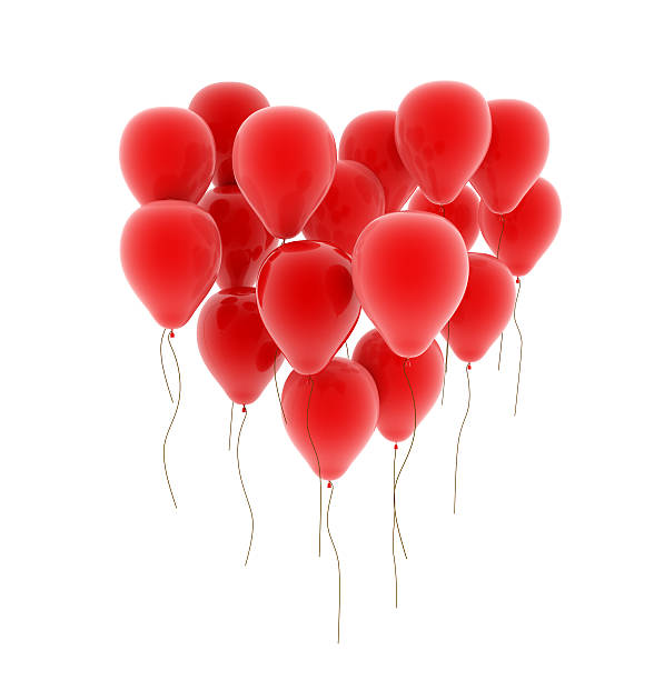 Red balloons forming the shape of heart on white background stock photo