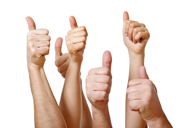 istock Several hands giving a thumbs up on white background 471119575