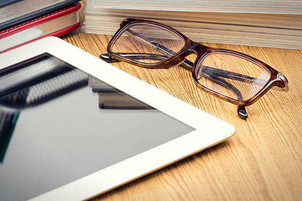 istock Tablet with blank screen  on office wooden table 471119870