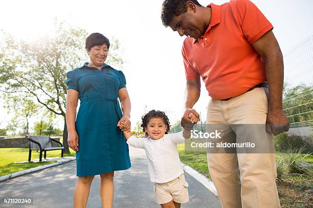 Happy Grandparents With Granddaughter Stock Photo - Download Image Now - Family, Footpath, Grandfather