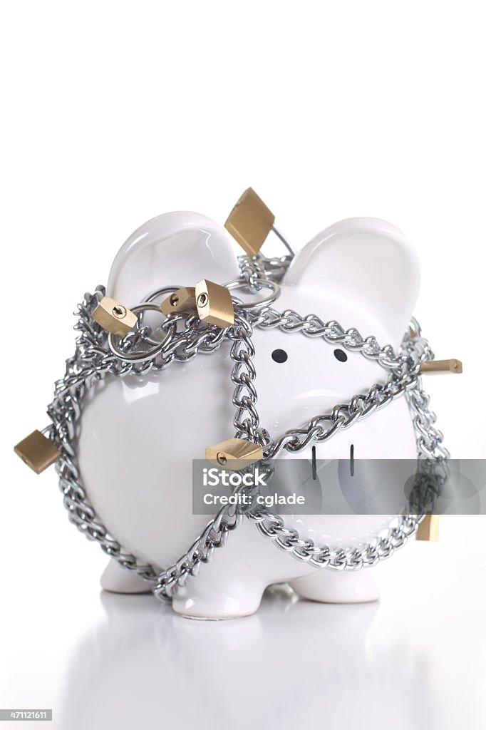 Protect Your Savings Piggy bank under lock and key, isolated on white Lock Stock Photo