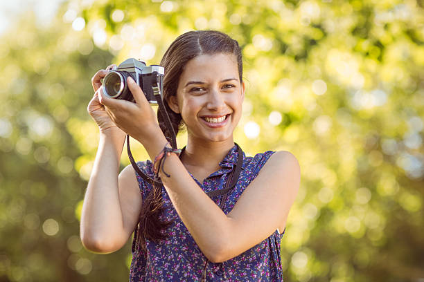 istock Pretty hipster taking a photo 471122778