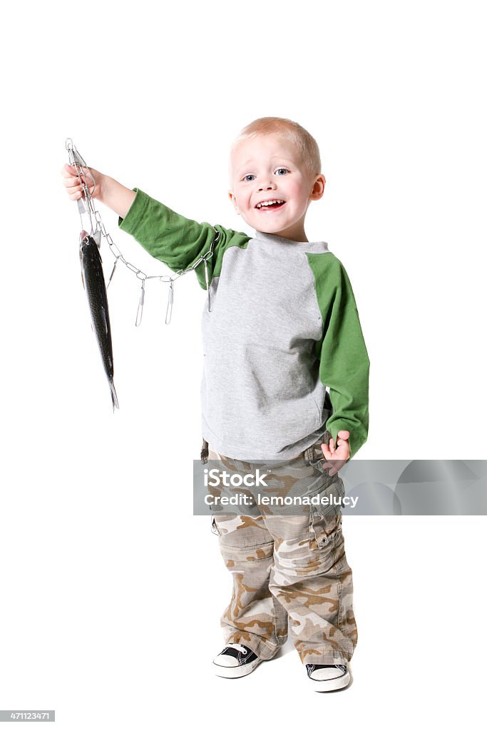 The future of fishing holds up his stringer proudly A young boy holds up a fish HE caught less than an hour earlier. Boys Stock Photo