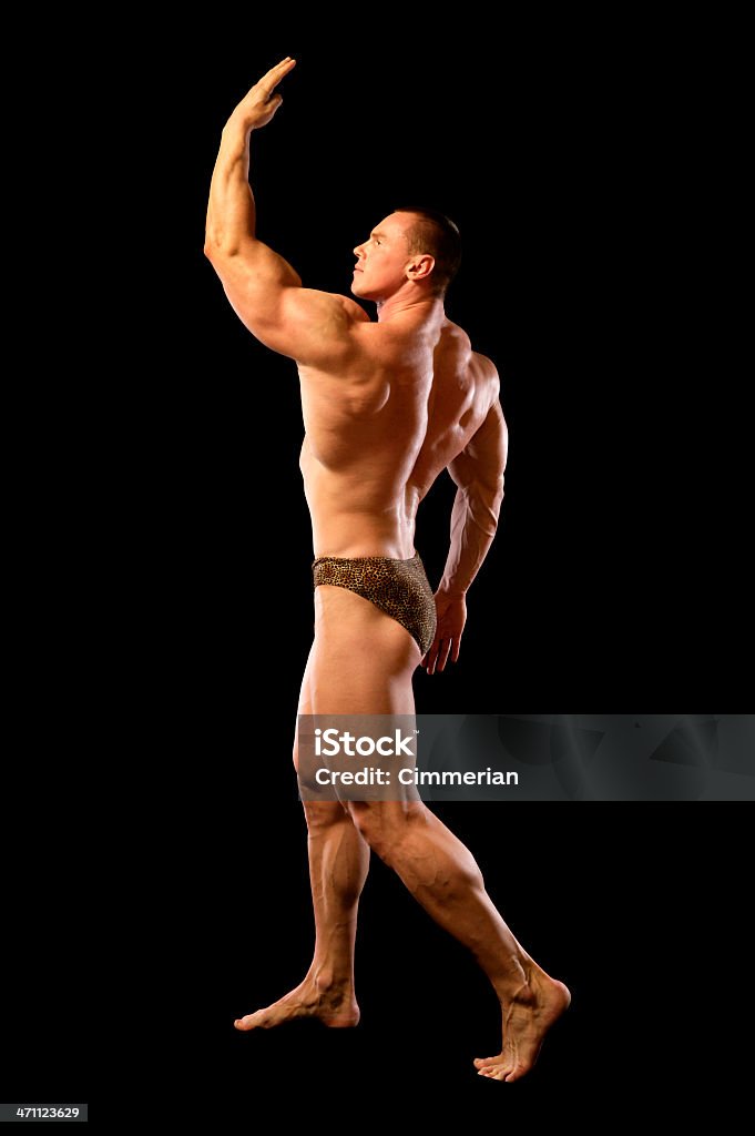Bodybuilder (XXL) Bodybuilder flexing his muscles, isolated on black. Active Lifestyle Stock Photo
