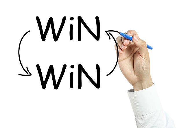 Businessman drawing win win concept Businessman is drawing win win concept with blue marker on transparent board isolated on white background. man writing on white board stock pictures, royalty-free photos & images