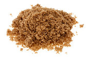 Pile of demerara sugar colored brown with molasses