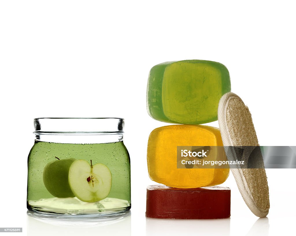 Spa treatment A composition of bar of soaps with apple shampoo and a sponge Apple - Fruit Stock Photo