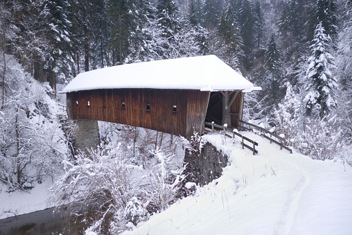Wooden bridge typical of the Alpine region in Europe.