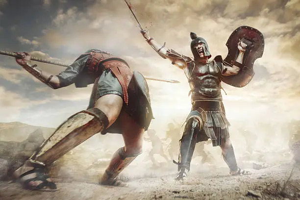 Ancient Greek rome warriors fighting with swords and shields in the combat on sand and dust. Achilles and Hector fighting at Troy