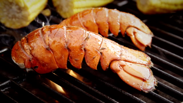 Delicious Lobster Tails and Sweetcorn on BBQ Grill