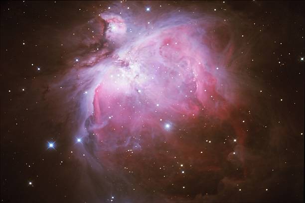 orion nebula in space with stars - orion bulutsusu stok fotoğraflar ve resimler