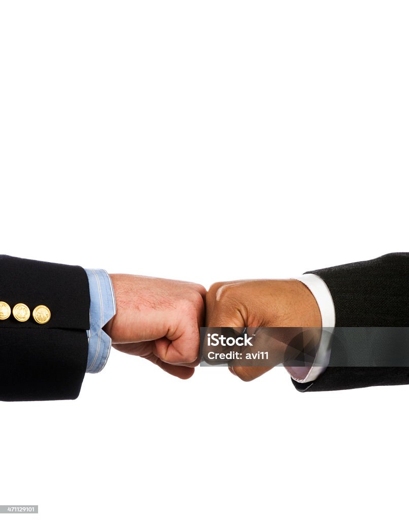 Business Fist Bump Two businessmen tap fists in the new and modern "fist bump" handshake. Team Photo Stock Photo