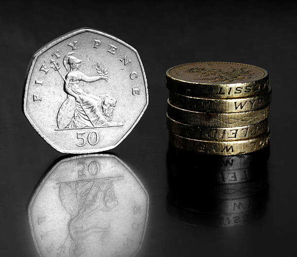 istock Studio shot of UK coins on black background 471129478