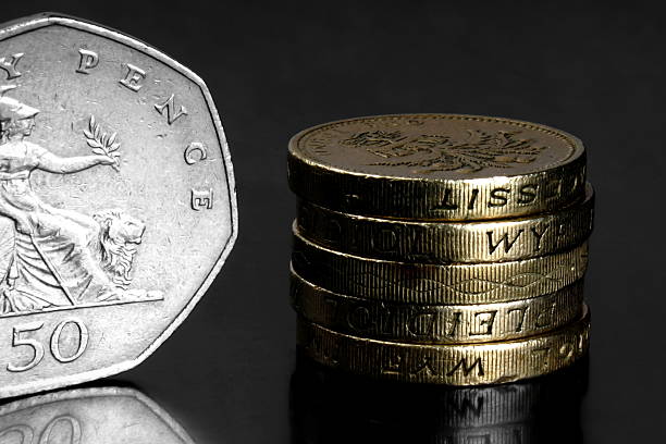 istock Studio shot of UK coins on black background 471129548
