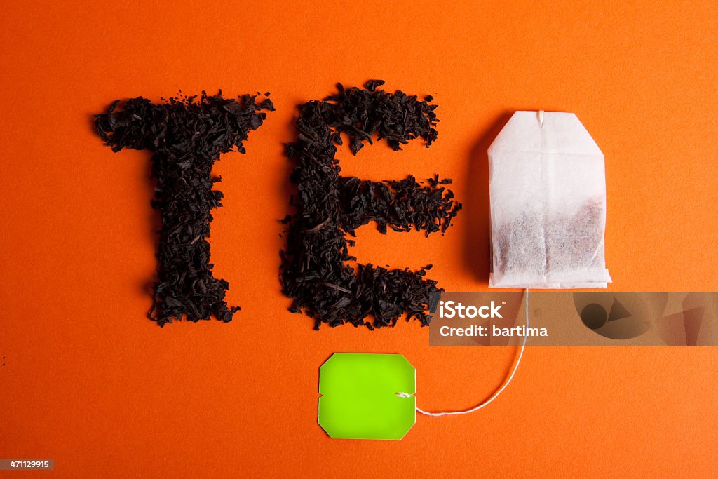 Tè in scrittura - Foto stock royalty-free di Arancione