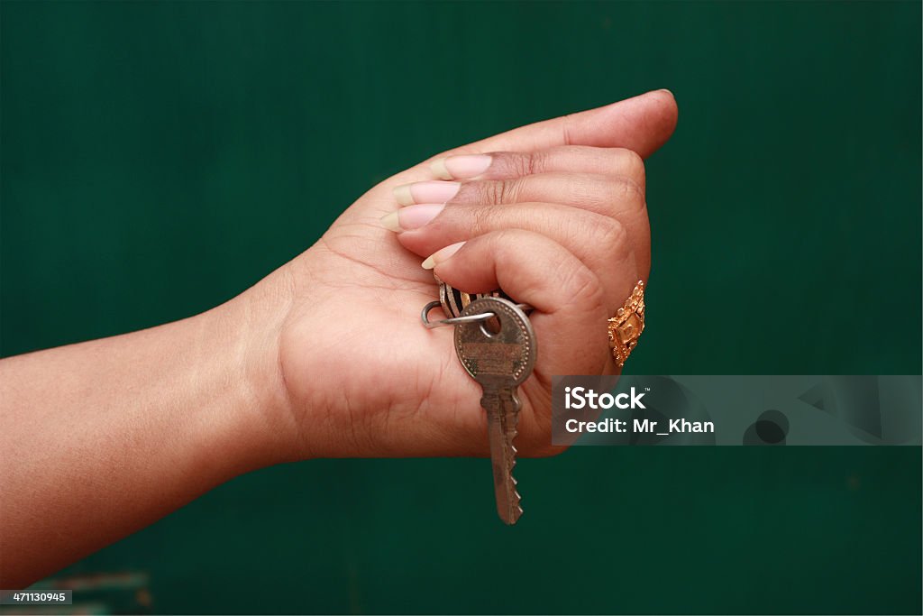 Key Girl holding a bunch of keys  Gripping Stock Photo